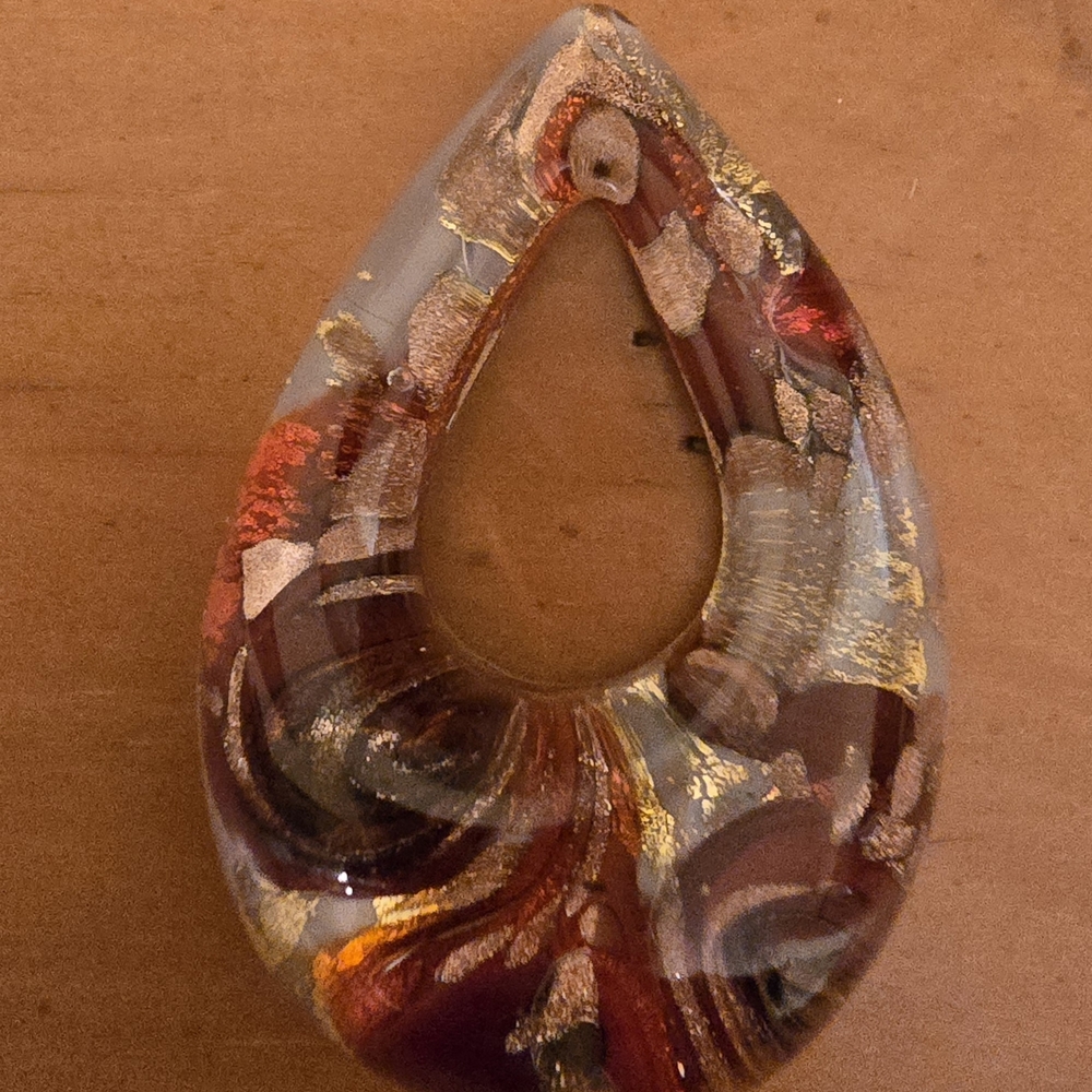 Artistic Teardrop Pendant with Gold and Red Accents